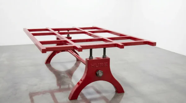 Hure table base with glossy red paint finish — hot-rolled steel, hand-finished in Phoenix