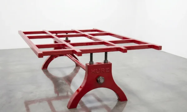Hure table base with glossy red paint finish — hot-rolled steel, hand-finished in Phoenix