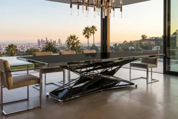 Anvil industrial dining table in open-plan Los Angeles home — stainless and black configuration