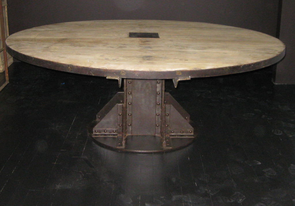 Antique French industrial oak dining table with riveted steel pedestal base — the inspiration for the Vintage Industrial I-Beam table design