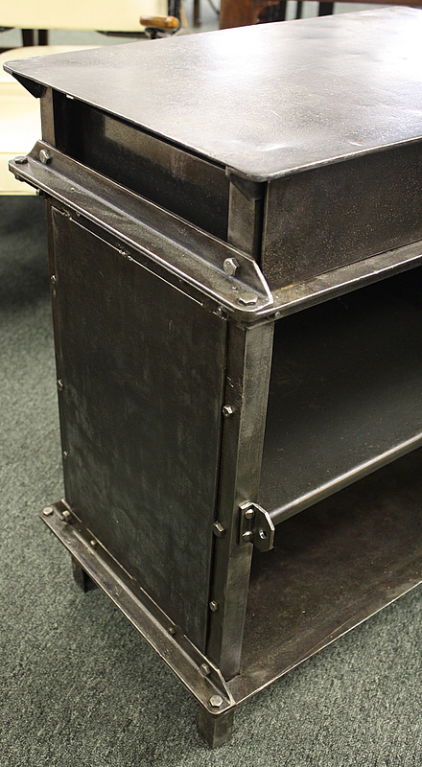 SNCF railway cabinet detail — angle iron molding and riveted panel construction that inspired the Ellis design